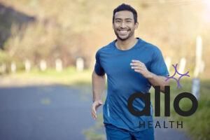 Man, smile in portrait and run outdoor, fitness and cardio with marathon, sports and athlete in nature. Asian male runner in road, happy with running exercise and training for race with mockup space. Masturbation for C-PTSD