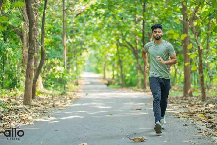 Young man running in the park at morning The Role of Nutrition and Exercise in Sexual Wellness