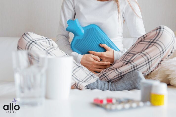 woman taking tablets for Vaginismus