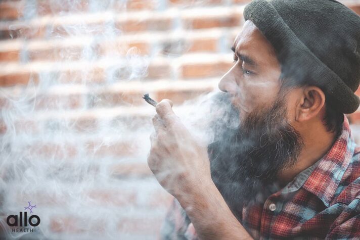 closed up mustache man smoke Cannabis joint THC transmission During Sex